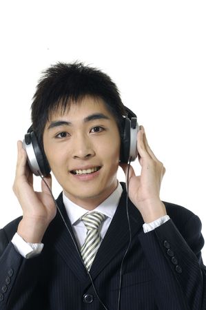 Asian young man feeling the musicの写真素材