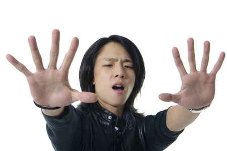 Young man in suit making stopの写真素材