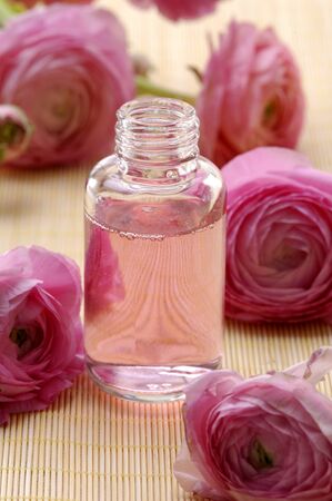  Perfume bottles with flower roseの写真素材