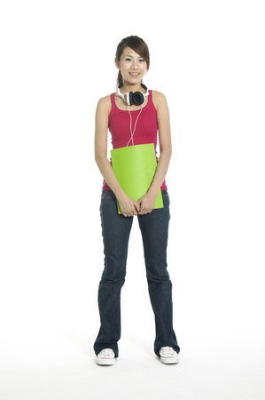 Headphones girl holding notebookの写真素材
