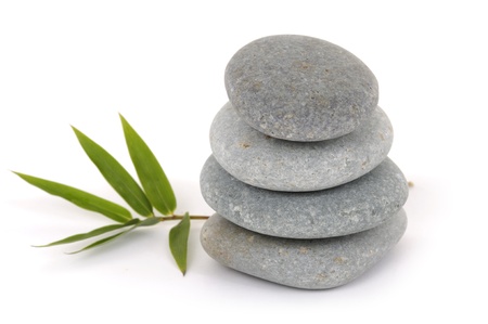 Stacked zen stones with bamboo leafの写真素材