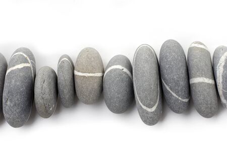 Row of nature striped sea stonesの写真素材