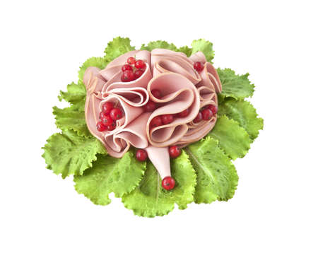 Sliced sausage, decorated in the form of a hedgehog on lettuceの写真素材