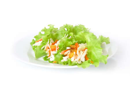 Salad with cabbage, carrots and raisins, wrapped in lettuce leavesの写真素材