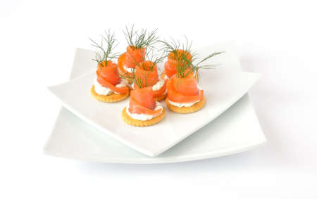 appetizer of salmon with cream sauce on crackersの写真素材