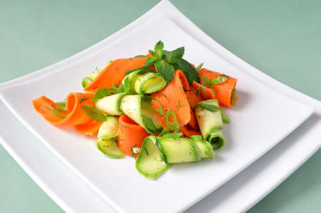 Zucchini salad with carrots and garlic marinade with herbsの写真素材