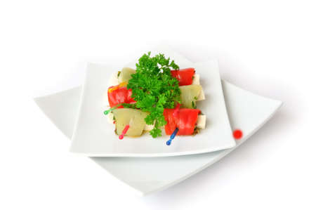 Rolls stuffed with goat cheese and capers in pepperの写真素材