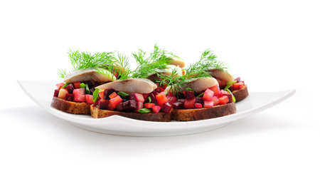 Sandwiches with rye bread, herring and vegetablesの写真素材