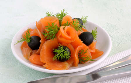 Appetizer of salmon with olives and dill closeupの写真素材