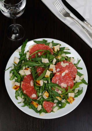 Salad with grilled chicken and arugula, grapefruit, almondsの写真素材