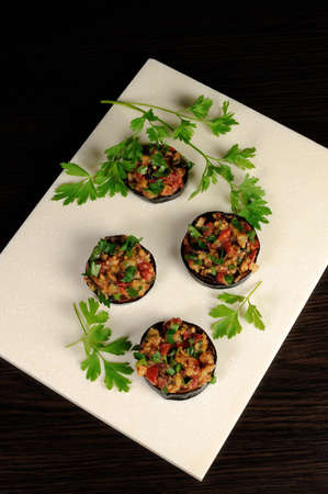 Appetizer of fried eggplant stuffed with vegetables, herbsの写真素材