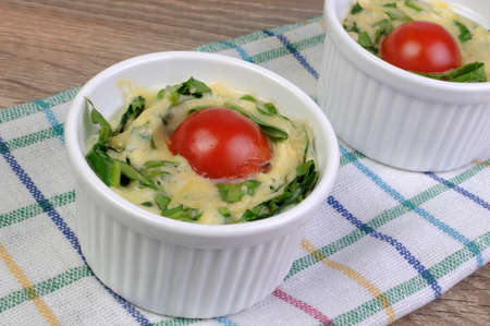 Omelet  spinach and cheese in the form of a batchの写真素材