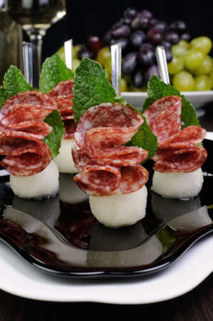 Canape of balls a melon and salami with mintの写真素材