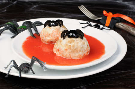 chicken meatballs in tomato gravy on the table in honor of Halloweenの写真素材