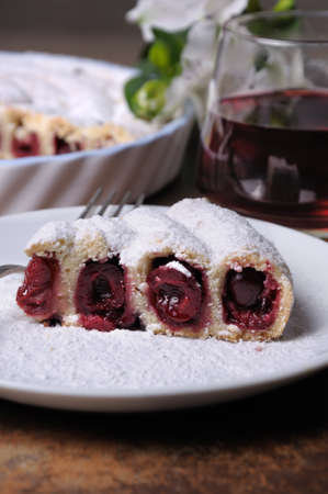 a piece of shortcrust  dough   stuffed with cherriesの写真素材