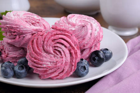 Homemade  berry  marshmallow (Zephyr) on a plate closeupの写真素材