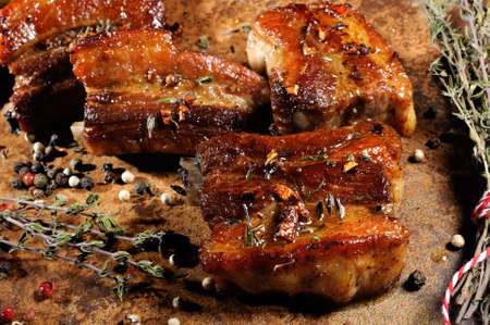 Marinated fried pork ribs with spices, garlic and cumin. Close-up. Foreground. Horizontal shot.の写真素材