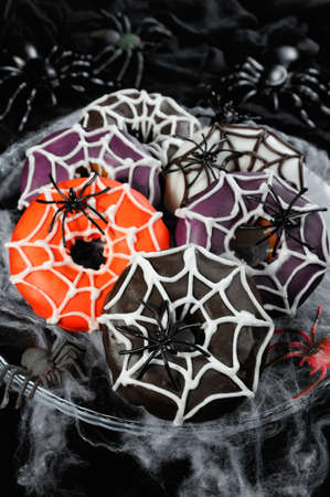 Glazed donuts decorated with cobwebs for Halloweenの写真素材