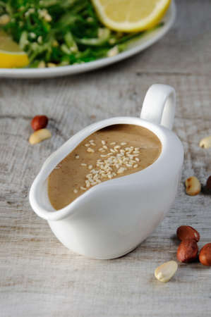 Peanut brown sauce for chuka salad with cucumber noodles and avocadoの写真素材
