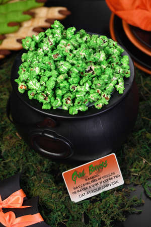 Cauldron green sweet popcorn for ghouls and zombies. Halloween treat
