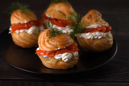 Profiteroles stuffed with cream cheese and salmon.の写真素材