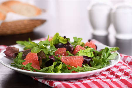 Grapefruit salad, a mix of lettuce, arugula and olive dressing. Dietary menu. Proper nutrition. Vegetarian food.の写真素材