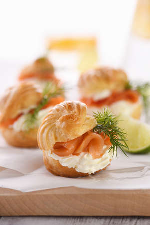Profiteroles stuffed with cream cheese and salmon.の写真素材