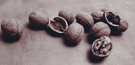 Food wallpaper. Walnuts on old table background for banner conceptの写真素材
