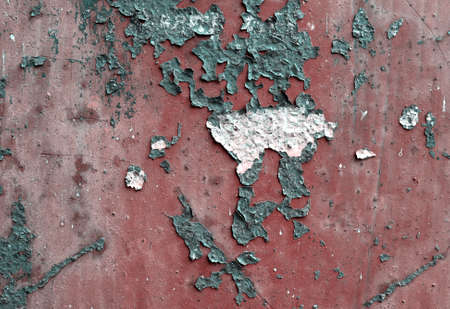 Vintage texture with old cracked paint on rusted metal surface