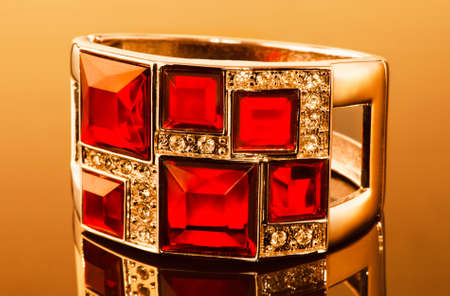 A beautiful gold bracelet with red gemstonesの写真素材