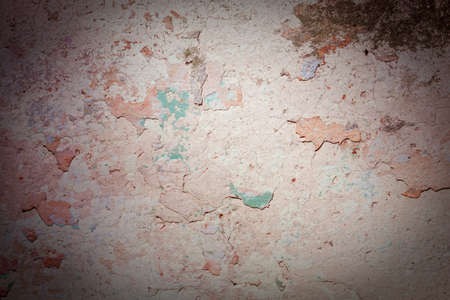 The old wall covered with plaster crashed