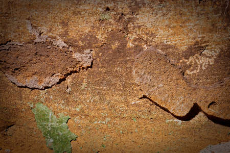 The old wall covered with plaster crashed