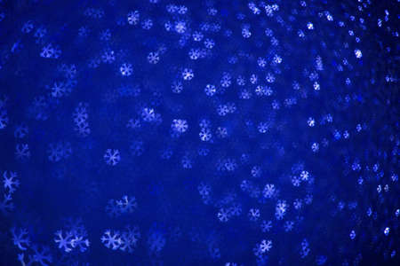Beautiful festive abstract background with many snowflakesの写真素材