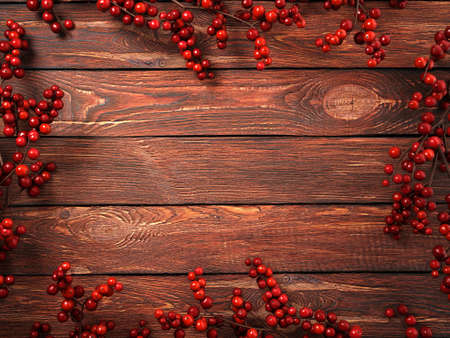 3D rendering dark christmas wooden background with branches and holly berriesの写真素材