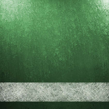 green background with white parchment ribbonの写真素材