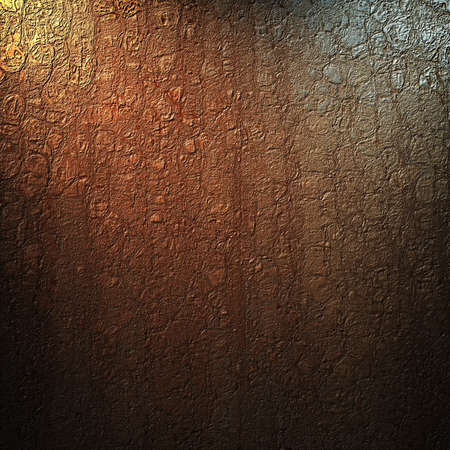 brown background with abstract vintage grunge crackle texture and soft corner lighting with dark black vignette shadows on border of frame の写真素材