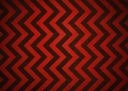 Retro red background of black chevron stripes, background has patterned wallpaper and vintage grunge background texture design, old abstract background paper for brochure or webの写真素材