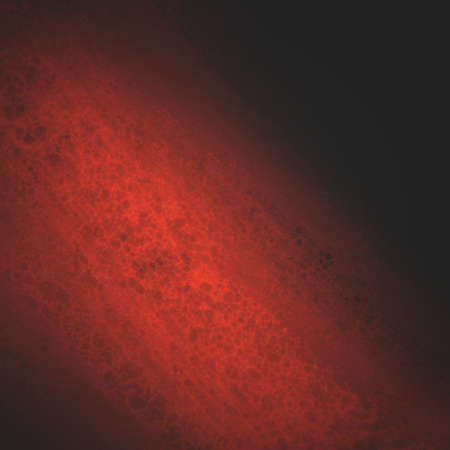 abstract red background design, rough black border with red streak or stream of bright light across dark contrasting black background, unique web design background or elegant brochure layout spaceの写真素材