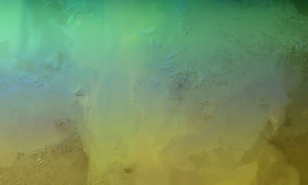 abstract green blue and yellow background with shiny metallic surface with pitted scuff marks and...