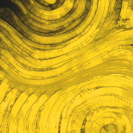 abstract gold background with glass textured waving stripesの写真素材