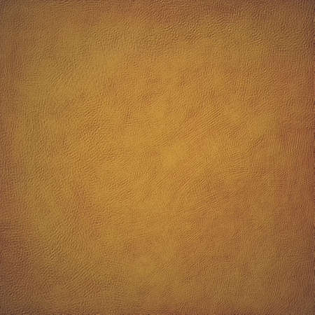 faded golden brown background with painted wall or canvas texture designの写真素材