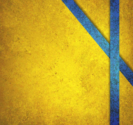 gold background with blue striped ribbons in abstract pattern on side border, artsy background layout with diagonal line intersecting with side ribbon. Has copyspace for text.の写真素材