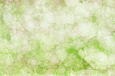 abstract glassy background pattern in soft pastel colors of green and white with brown stain grunge, glass textured ripples or wrinkles in pretty graphic art design for websites or projectsの写真素材