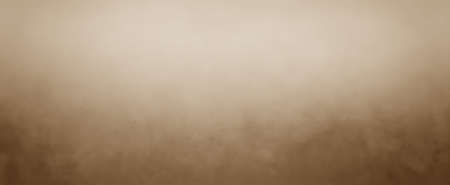 Soft brown background with light center and dark border and vintage mottled textureの写真素材