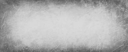 Old black and white background with dark gray border, abstract vintage background with wrinkled leather and grunge style texture patternの写真素材