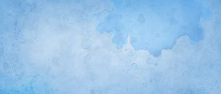 blue background with soft watercolor paint wash and faded vintage paper texture in pastel blue color background design, distressed paint spatter and grunge with fringe bleed borderの写真素材