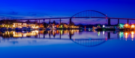 Reflection of Chesapeake City in the Chesapeake and Delaware Canal, Maryland.の写真素材