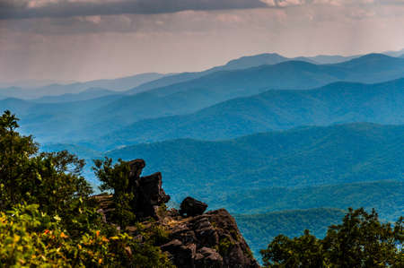 Rock outcrop on North Marshall and view of the Blue Ridge in Shenandoah National Park, Virginia.の写真素材
