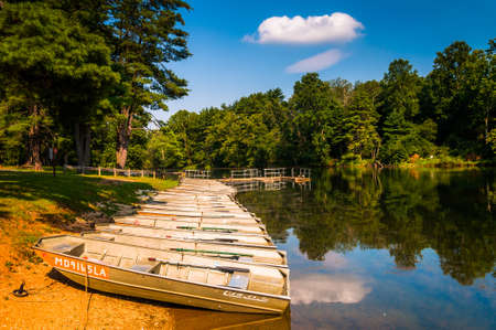 Boats along the shore of Loch Raven Reservoir, near Towson, Maryland.の写真素材
