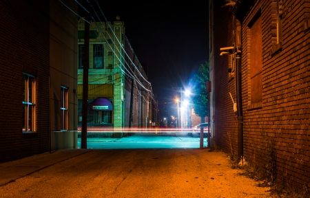 Dark alley and light trails in Hanover, Pennsylvania at night.